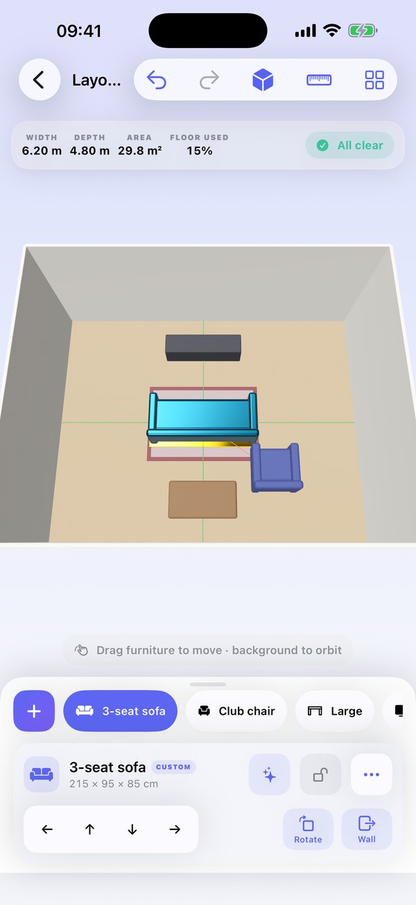 3D room editor with a sofa, chair and rug placed